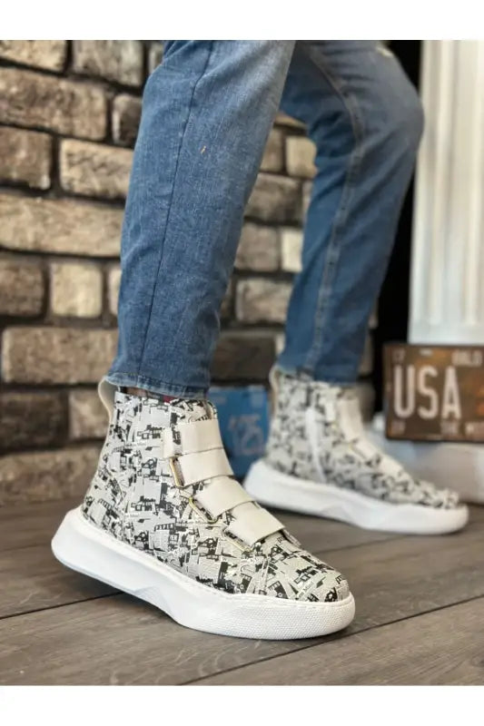 High-top sneakers with black and white butterfly print pattern and white soles.