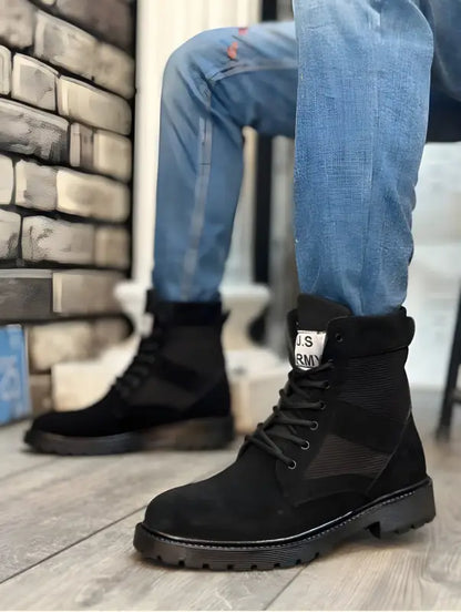 Black suede combat boots with thick rubber soles and laces.