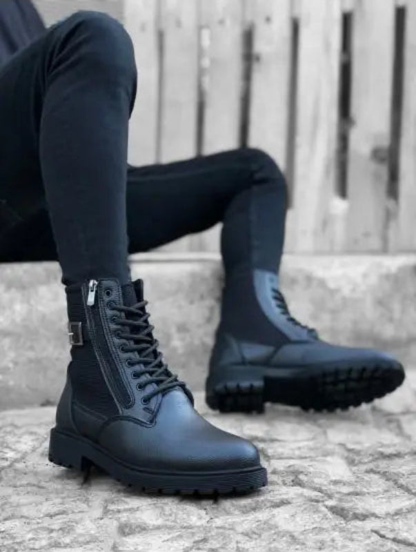 Black combat boots with side zippers and chunky treaded soles.