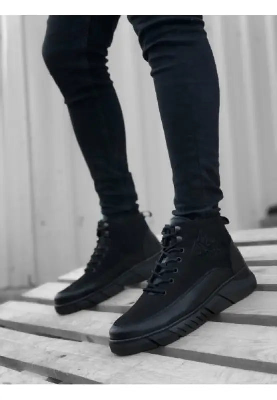 Black leather high-top boots.