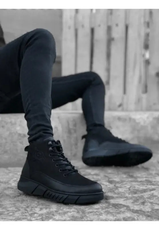 Black lace-up boots.