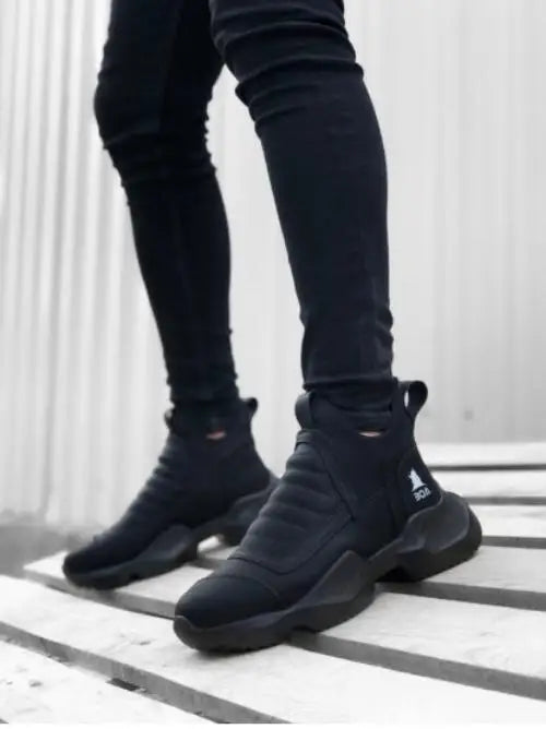 Black athletic sock-style sneakers with chunky soles.