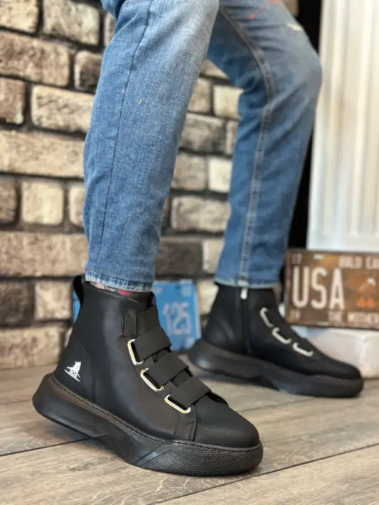 Black leather Adidas high-top sneakers with velcro straps.