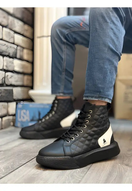 Black high-top leather sneakers with white heel accents and black laces.