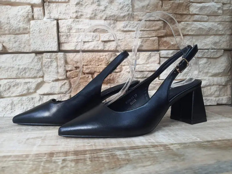 Black leather slingback heels with chunky square heels.