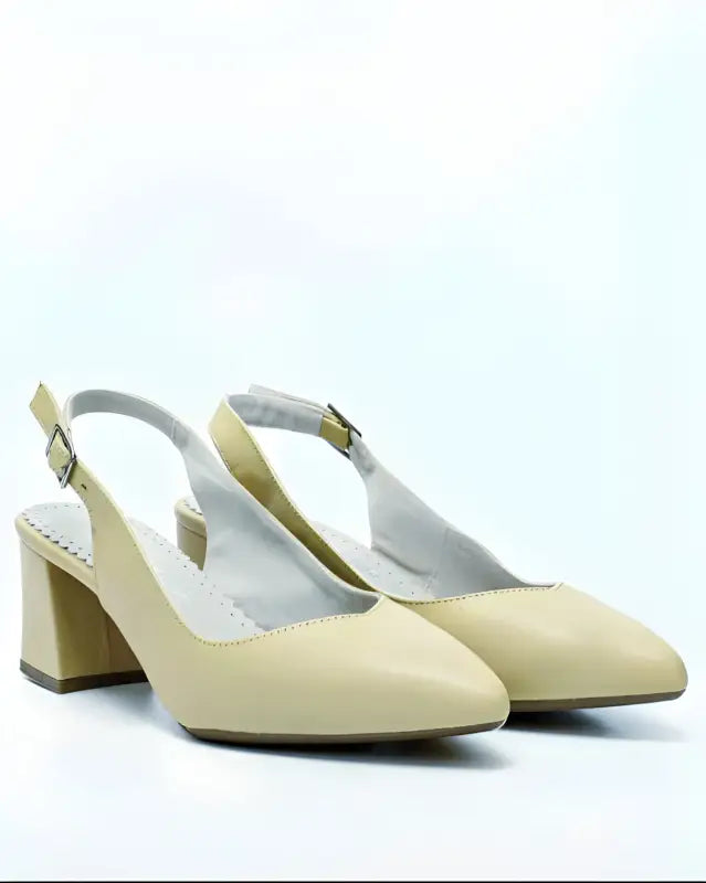 Beige slingback pumps with block heels.