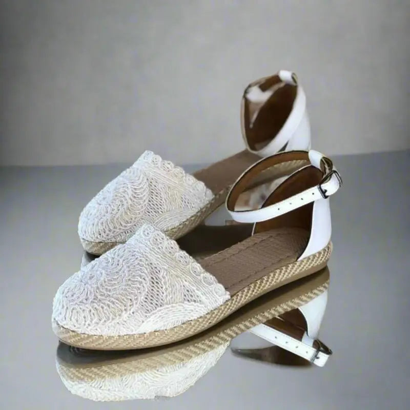 White lace espadrilles with ankle straps.