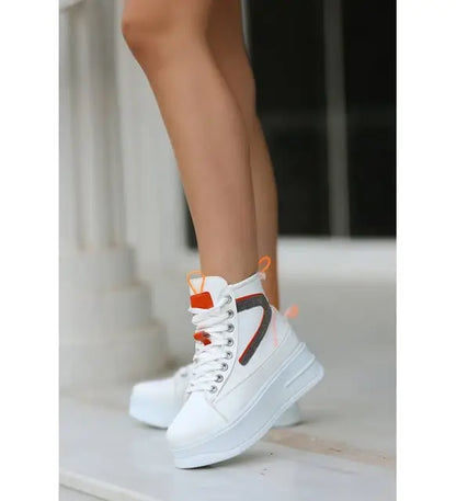 White high-top sneakers with orange and brown accents.