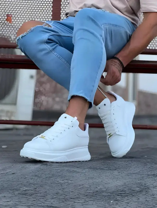 White platform sneakers with chunky soles and laces.