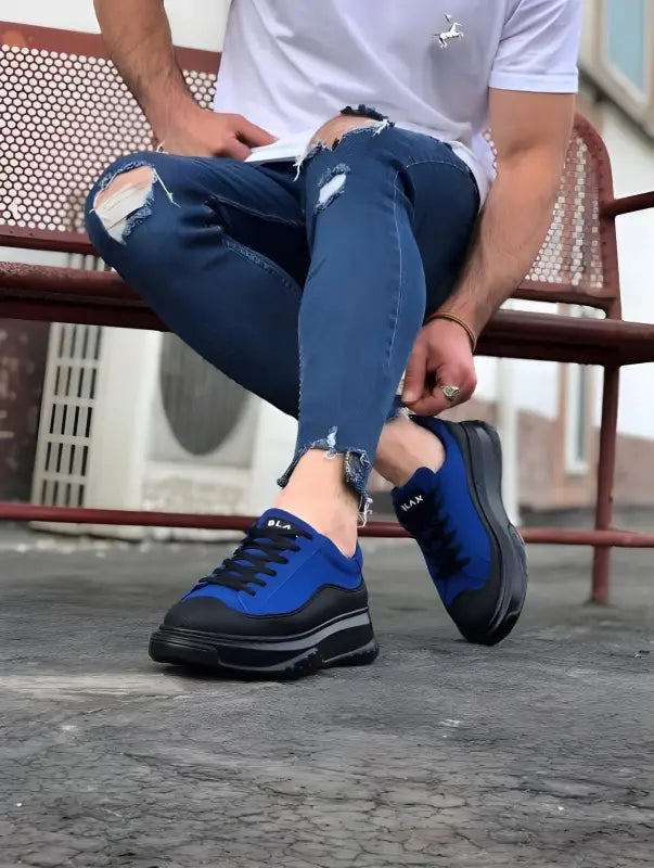 Blue and black chunky sneakers with a thick platform sole.