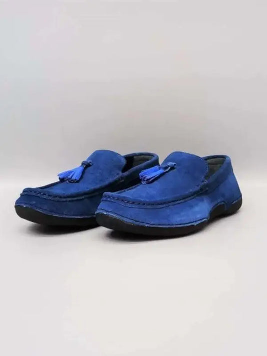 Bright blue suede loafers with tassels.