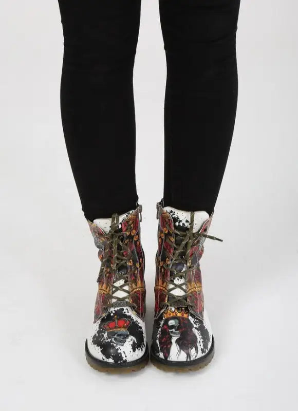 Floral-patterned combat boots with black laces worn with dark tights.