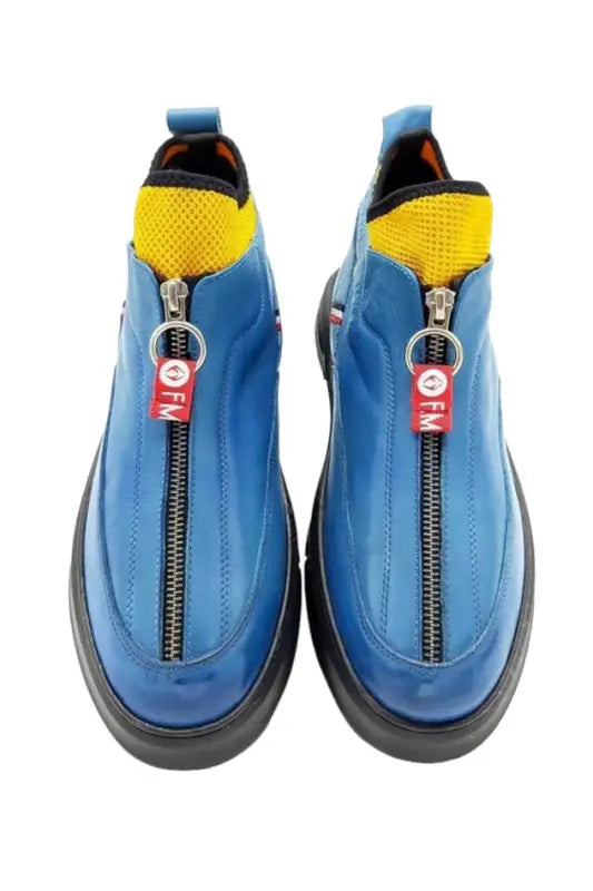 Blue sneakers with yellow accents and front zipper closures.