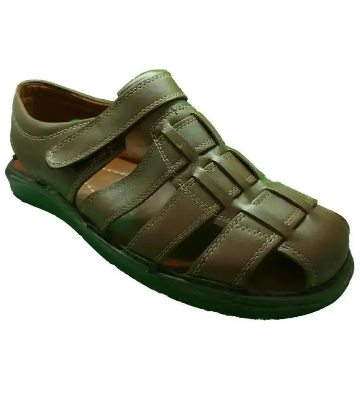 Brown leather sandal with velcro strap and closed toe design.