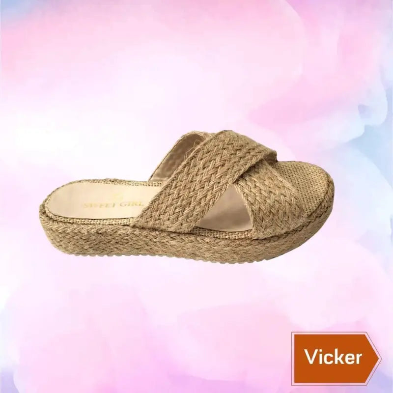 Woven beige cross-strap sandal with a platform sole.