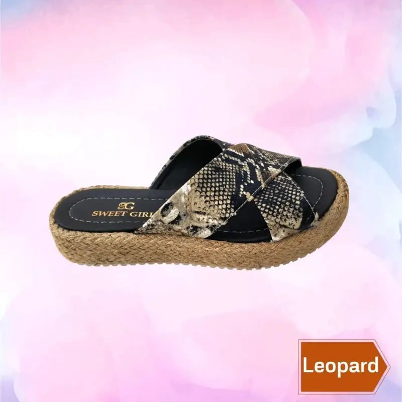 Snake print cross-strap sandal with an espadrille-style rope sole.