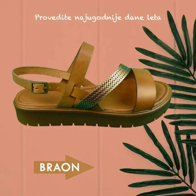 Brown leather sandal with metallic accented straps and a platform sole.