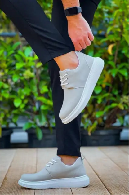 Light gray casual sneaker with white sole and laces.