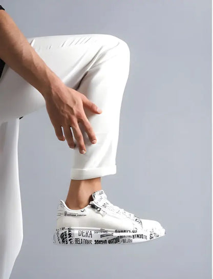 White sneaker with black newspaper-style text print pattern on its surface.