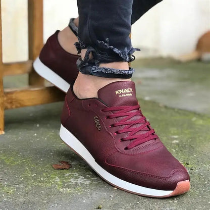 Burgundy leather sneaker with white sole and matching laces.