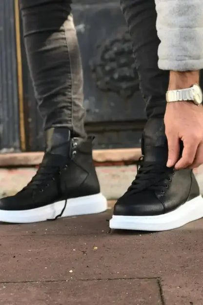 Black high-top sneakers with white soles.