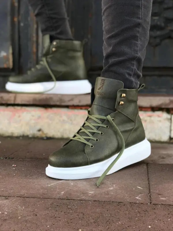 Olive green high-top sneaker boot with white sole and laces.