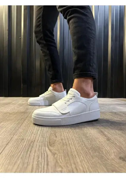 White platform sneakers with a chunky sole and velcro strap.