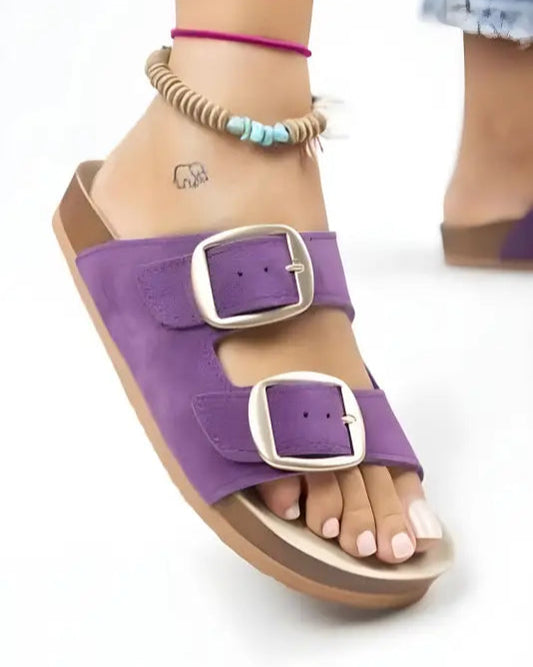 Purple double-buckle sandal with a cork-style footbed.