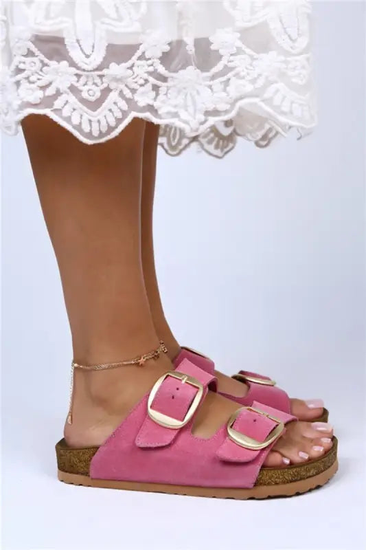 Pink double-buckle Birkenstock-style sandal with cork footbed.