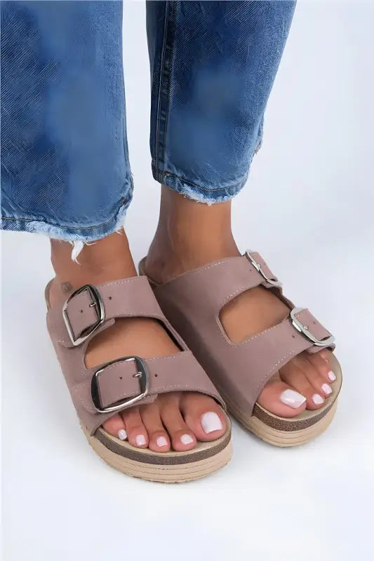 Taupe double-buckle sandals with a platform sole and adjustable straps.