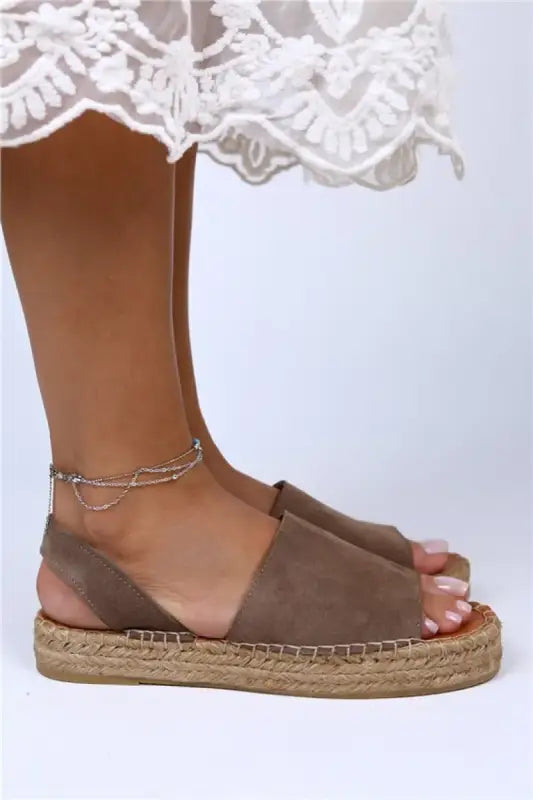 Brown suede espadrille sandal with a jute sole and ankle strap.