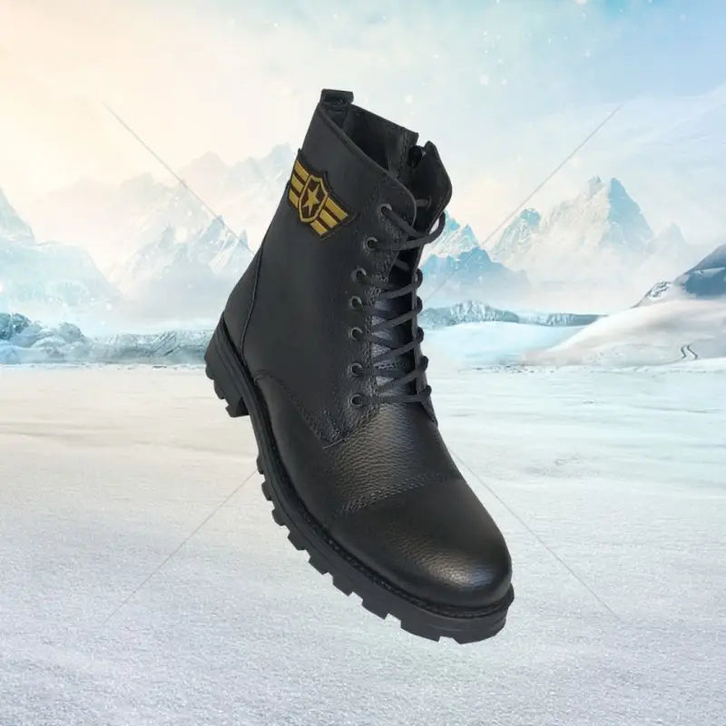 Black leather combat boot with gold logo detailing and chunky rubber sole.