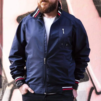 Navy blue bomber jacket with red and white striped trim.