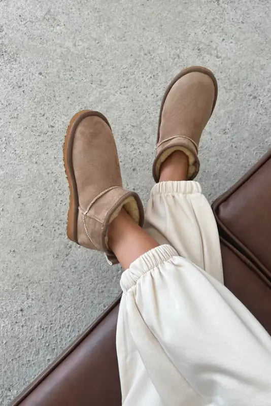 Beige suede Ugg boots.