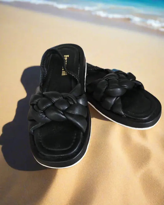 Black woven slide sandals with a padded design.