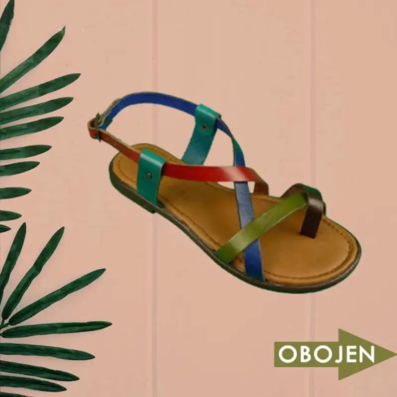 Colorful strappy leather sandal with green, red, and blue bands crossing the foot.