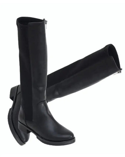 Black leather knee-high boots with a flat sole and back zipper.