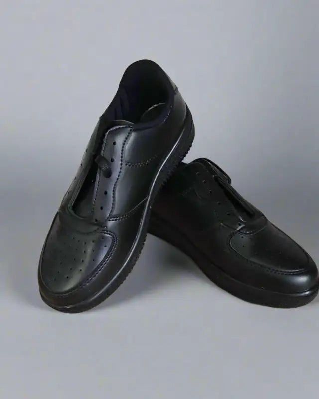 Black leather slip-on dress shoes.