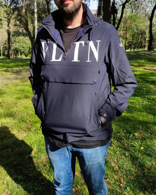 Navy blue pullover jacket with ’VLTN’ text across the chest.